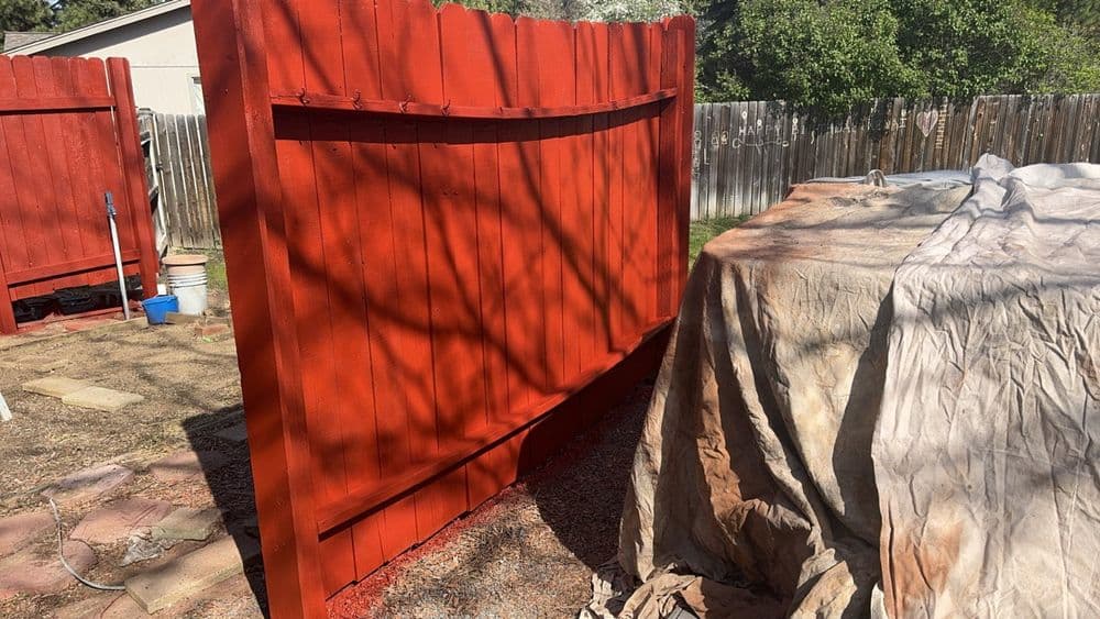 Wood Fence Repaint With Bold Red in Tetherow